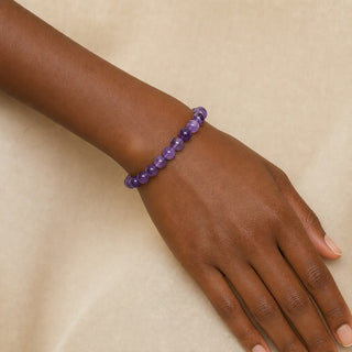 Amethyst bead bracelet worn on a wrist