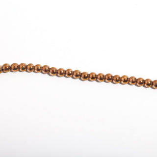Copper Hematite Bead Strand (Enhanced) — BE6cDSC142966, new photo on a clean white background. Stonebridge Imports.
