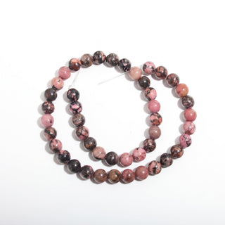 Rhodochrosite Bead Strand — BE8SDC38638, new photo on a clean white background. Stonebridge Imports.