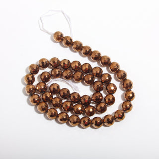 Copper Hematite Bead Strand (Enhanced) — BE8cDSC142942, new photo on a clean white background. Stonebridge Imports.