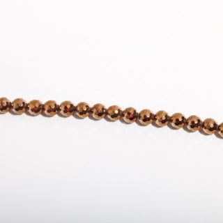 Copper Hematite Bead Strand (Enhanced) — BE8cDSC142942, new photo on a clean white background. Stonebridge Imports.