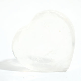 Clear Quartz Heart Bowl, a shallow heart-shaped dish carved from milky translucent clear quartz with soft internal veils, photographed on a clean white background. Stonebridge Imports.