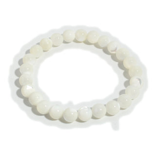 Shell White Round Bracelet with 8 mm polished natural white shell beads on stretch cord, laid flat and photographed on a clean white background. Stonebridge Imports.