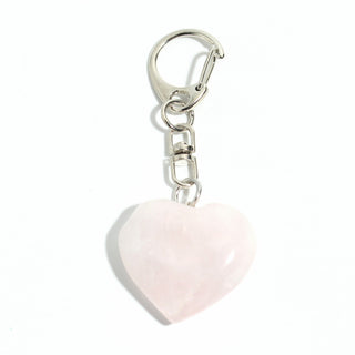 Rose Quartz Heart Charm - Pack of 5 - a single polished soft pink rose quartz heart from the pack on its silver-tone swivel clasp and keyring, photographed on a clean white background. Stonebridge Imports.