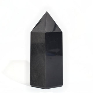 Black Obsidian Generator Unique #5 — polished six-sided tower with a faceted point, seen from a second angle, photographed on a clean white background. Stonebridge Imports.