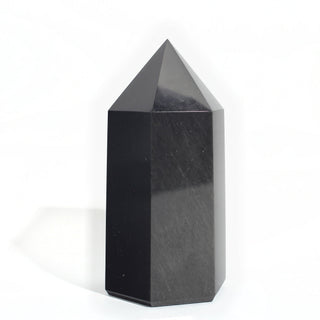 Black Obsidian Generator Unique #5 — polished six-sided tower with a faceted point, seen from a third angle, photographed on a clean white background. Stonebridge Imports.