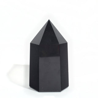 Black Obsidian Generator Unique #8 — polished six-sided tower with a faceted point, seen from a second angle, photographed on a clean white background. Stonebridge Imports.
