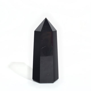 Black Obsidian Generator Unique #15 — polished six-sided tower with a faceted point, seen from a second angle, photographed on a clean white background. Stonebridge Imports.