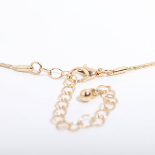 Gold Plated Zodiac Necklace — detail of the gold lobster clasp and adjustable extender chain, photographed on a clean white background. Stonebridge Imports.