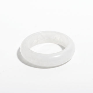 Clear Quartz Ring — solid clear quartz stone band ring, alternate angle photographed on a clean white background. Stonebridge Imports.