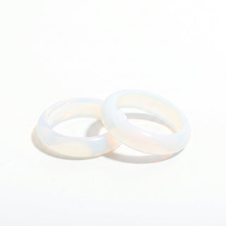 Opalite Ring — solid milky blue-white opalite stone band ring, photographed on a clean white background. Stonebridge Imports.
