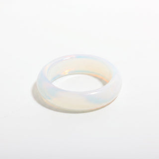Opalite Ring — solid milky blue-white opalite stone band ring, alternate angle photographed on a clean white background. Stonebridge Imports.