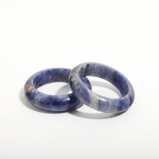 Sodalite Ring — solid royal-blue sodalite with white veining stone band ring, photographed on a clean white background. Stonebridge Imports.