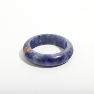 Sodalite Ring — solid royal-blue sodalite with white veining stone band ring, alternate angle photographed on a clean white background. Stonebridge Imports.