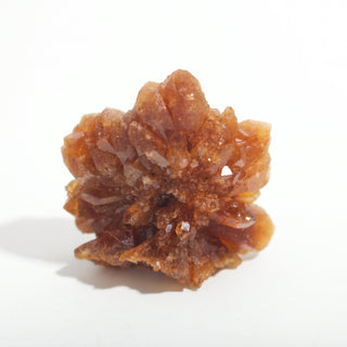 1 1/2" — Natural Citrine - Morocco, a honey-amber crystal cluster rosette of small pointed crystals with translucent golden tips, photographed on a clean white background. Stonebridge Imports.