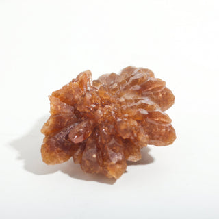 1 1/2" — Natural Citrine - Morocco, a second example cluster, a starburst of orange-brown crystal points, photographed on a clean white background. Stonebridge Imports.
