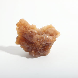 1 1/2" — Natural Citrine - Morocco, a fan-shaped cluster of honey-coloured crystal blades on a pale tan base, photographed on a clean white background. Stonebridge Imports.