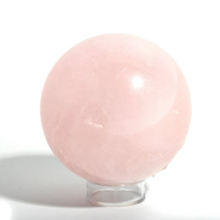 Close view of Rose Quartz Sphere Unique #192 showing the glossy polish and soft milky pink interior of the stone, on a clean white background. Stonebridge Imports.