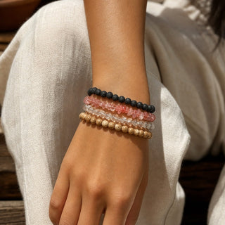 Cherry Quartz bead bracelet stacked with other bead bracelets on the wrist