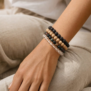 Bloodstone bead bracelet stacked with other bead bracelets on the wrist