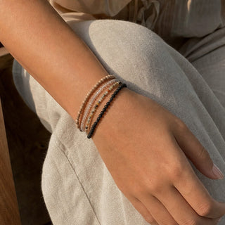 Bumblebee Jasper bead bracelet stacked with other bead bracelets on the wrist