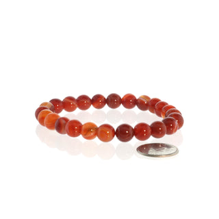 Banded Carnelian bead bracelet on a white background