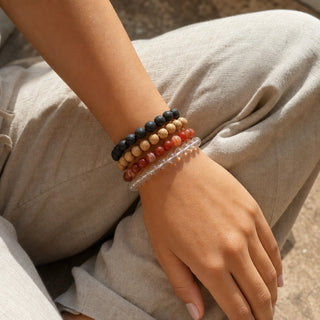 Banded Carnelian bead bracelet stacked with other bead bracelets on the wrist