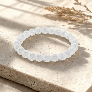 Crackle Quartz bead bracelet resting on a stone slab