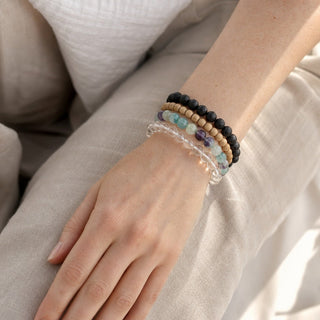 Fluorite bead bracelet stacked with other bead bracelets on the wrist