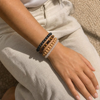 Gold Tiger's Eye bead bracelet stacked with other bead bracelets on the wrist