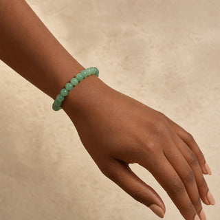 Green Aventurine bead bracelet worn on the wrist, close-up