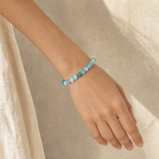 Hemimorphite bead bracelet worn on the wrist, close-up