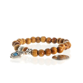 Wood Bead Bracelet with Buddha and Hamsa Charm from The Rock Space