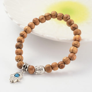 Wood Bead Bracelet with Buddha and Hamsa Charm from The Rock Space