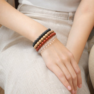 Red Jasper bead bracelet stacked with other bead bracelets on the wrist