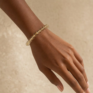 Lemon Quartz bead bracelet worn on the wrist, close-up