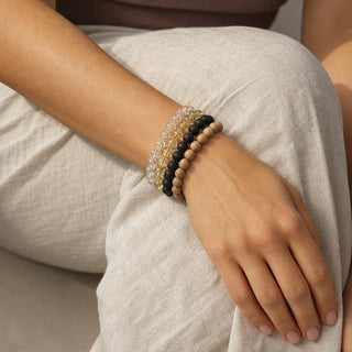 Lemon Quartz bead bracelet stacked with other bead bracelets on the wrist
