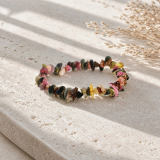Multi-Colour Tourmaline bead bracelet resting on a stone slab