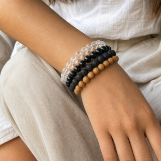 Rainbow Obsidian bead bracelet stacked with other bead bracelets on the wrist