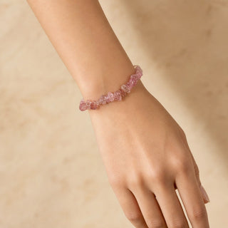Strawberry Quartz bead bracelet worn on the wrist, close-up