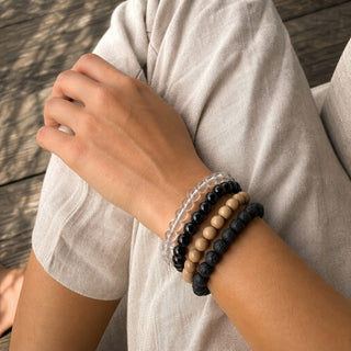Shungite bead bracelet stacked with other bead bracelets on the wrist