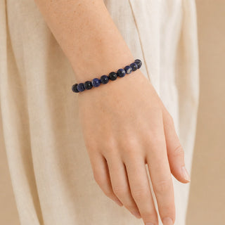Sodalite bead bracelet worn on the wrist, close-up