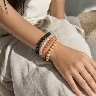 Sunstone bead bracelet stacked with other bead bracelets on the wrist