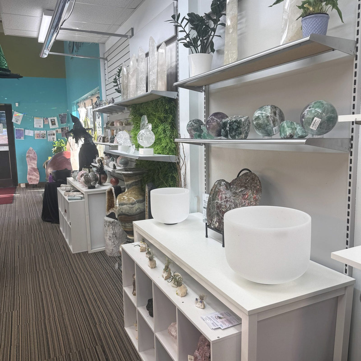 Singing bowls and crystal displays inside The Rock Space