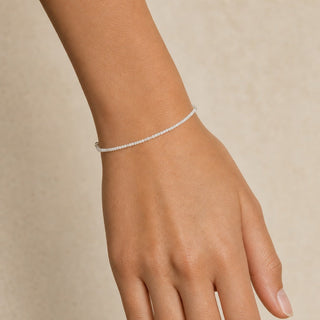 White Moonstone bead bracelet worn on the wrist, close-up